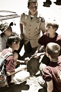 Scouts planning a survival shelter.